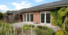 Ebenerdiges 2-Zi-Reihenmittelhaus mit Terrasse, Gartenanteil und Stellplatz in Augustfehn