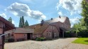 rückwärtige Ansichten von der Bauerndiele und der Landhaus-Villa