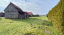 Blick über das Baugrundstück (Holzschuppen als Altbestand) in süd-westlicher Ausrichtung