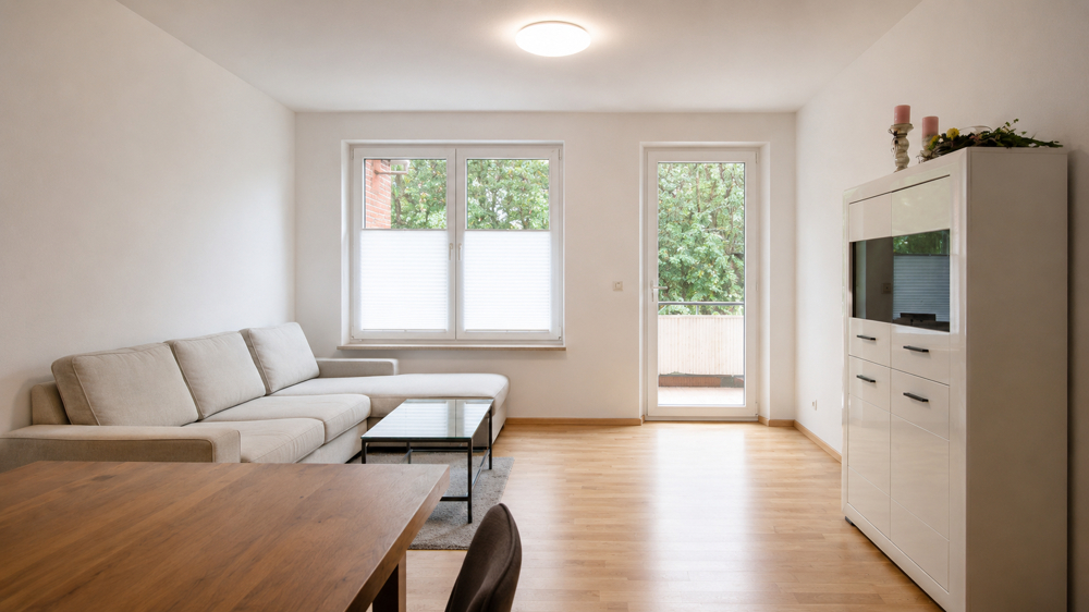 Dachgeschosswohnung mit Balkon und Pkw-Stellplatz in Westerstede - zentrale Wohnlage - Photo 1